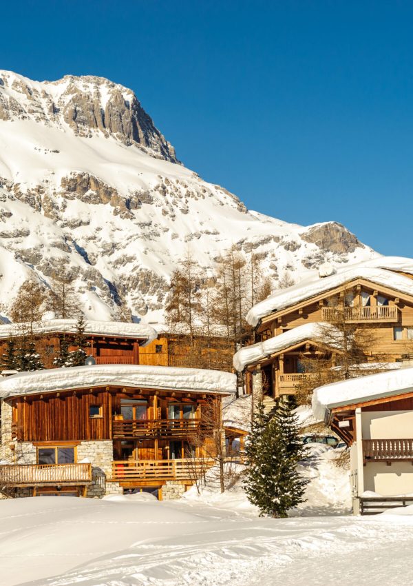 Alpine winter mountain landscape. French Alps covered with snow in sunny day. Val-d'Isere, France